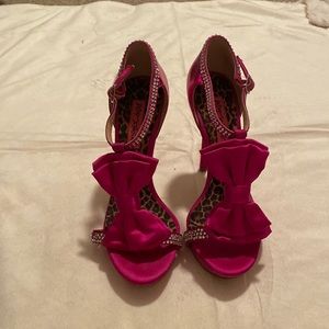 Strappy open-toe heels with bow and rhinestone embellishment.